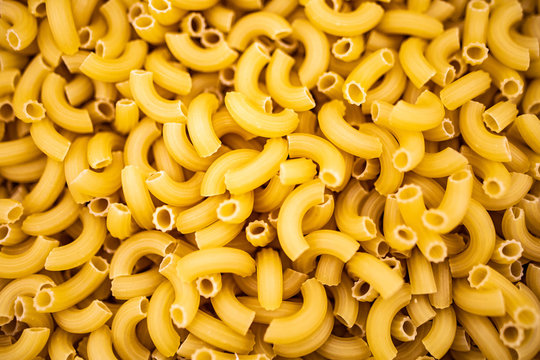 A large number of pasta. Background of raw pasta. Flour products