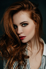 young woman fashion studio portrait, brunette in stylish clothes