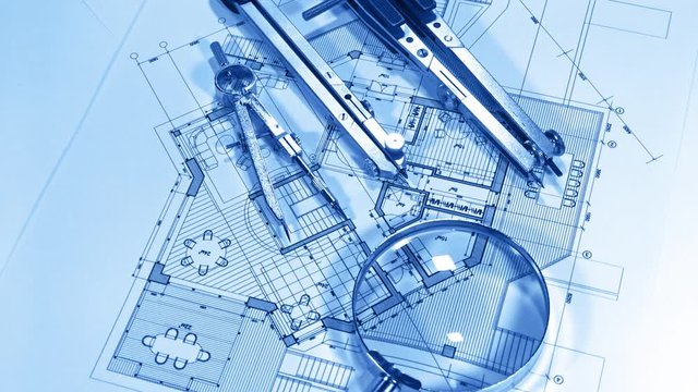 Blueprints - architectural drawings, loupe - magnifying glass and compasses smoothly rotate on the surface of the architectural plan of a modern house