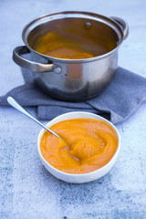 Cooked yellow pumpkin puree with in bowl. Vegan, vegetarian. Creamy.