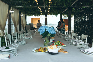 Flowers in a vase on the table as a decoration. Event or celebration.
