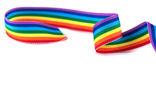 Gay pride rainbow curly ribbon isolated on white background. Abstract LGBT minimal concept