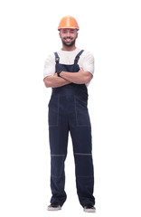 in full growth. smiling man in overalls and a safety helmet