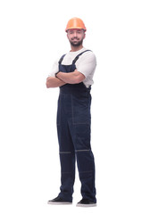 in full growth. smiling man in overalls and a safety helmet