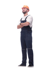 in full growth. smiling man in overalls and a safety helmet