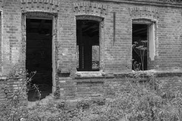 Fototapeta na wymiar Ruins, old, brick, abandoned house. black-and-white photo.
