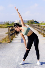 sport and lifestyle concept - woman doing sports outdoors