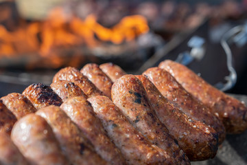 Fried sausages for sell in street food market, Ukraine, closeup