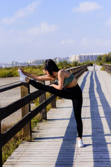 sport and lifestyle concept - woman doing sports outdoors