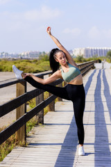 sport and lifestyle concept - woman doing sports outdoors