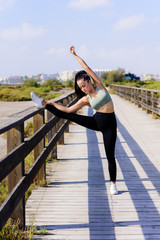 sport and lifestyle concept - woman doing sports outdoors