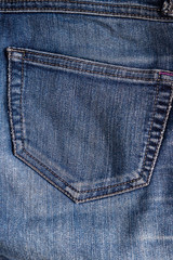 Top view of denim jeans texture with pocket. Canvas jeans background of blue color with details