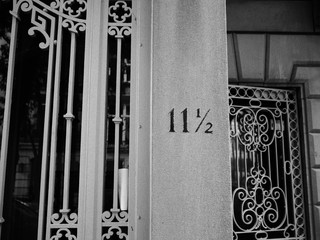 number 11 and a half on entrance of classic building in city