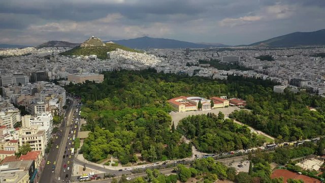 Aerial video taken by drone of iconic public Zappeio hall used for events and lycabettus hill at the background , Athens historic centre, Attica, Greece