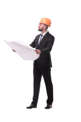 businessman in helmet looking at new drawings . isolated on white