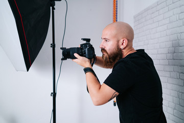 an photographer with camera in studio