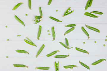 Food photography. Peas scattered on a white board