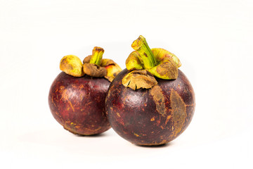 Fototapeta premium Two mangosteen fruits isolated on white background