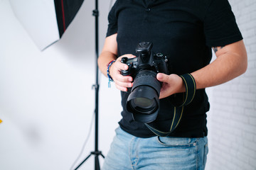 an photographer with camera in studio