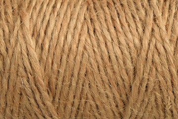 Natural jute tie texture. Twine string in bobbin. Side view