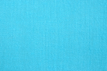Light blue cotton fabric texture. Thin textile material . Closeup