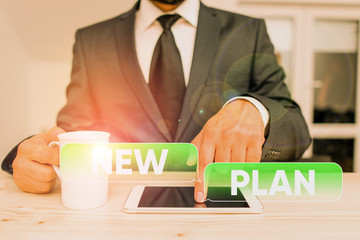 Word writing text New Plan. Business photo showcasing Start of a detailed proposal of doing or...