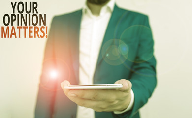Word writing text Your Opinion Matters. Business photo showcasing show you do not agree with something that just been said Business concept with man holding mobile phone with touch screen