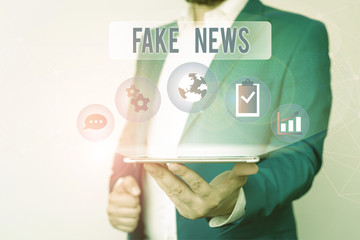 Text sign showing Fake News. Business photo text Giving information to showing that is not true by...