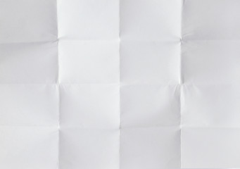 Blank white sheet of paper folded 4 times 