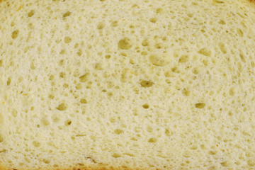 Bread texture. Long loaf piece. Closeup