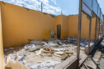 Dismantling of an illegally built store, the rest of the walls, construction waste