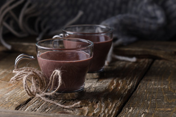 Hot chocolate and woolen blanket, cozy autumn