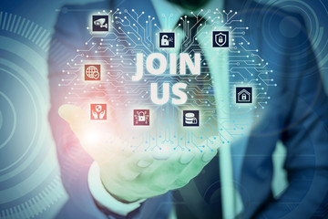 Conceptual hand writing showing Join Us. Concept meaning Register in community Team or blog Sign up at social media Male wear formal suit presenting presentation smart device