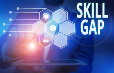 Fototapeta premium Conceptual hand writing showing Skill Gap. Concept meaning Refering to a demonstrating s is weakness or limitation of knowlege Male wear formal suit presenting presentation smart device