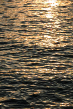 Sunset above the golden lake or the golden sea