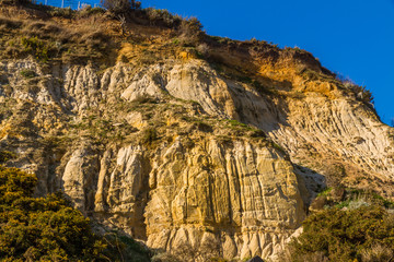 Fototapeta na wymiar Easily eroded sandstone cliff, landscape