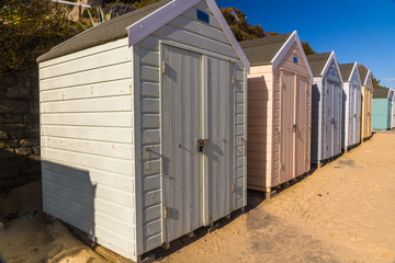 Beach huts in a row on sunny day, landscape