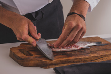 chef cutting fish