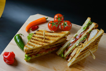 An appetizing meal on a wooden board with fresh vegetables.