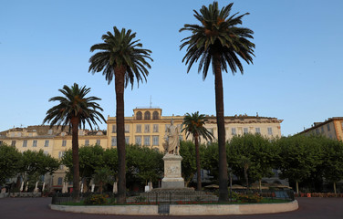 Fototapeta na wymiar View of the Place Saint-Nicolas square in Bastia, Corsica, France, highlighting the old statue of Napoleon Bonaparte as a roman emperor, sculpted on 1813. Corsica island.