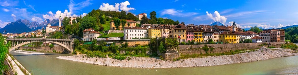 Breathtaking panorama of beautiful Belluno town surrounded by Dolomites mountains. Northen Italy - obrazy, fototapety, plakaty