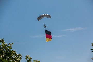 German skydiver in the air with German flag