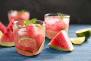 Delicious refreshing watermelon drink on blue wooden table