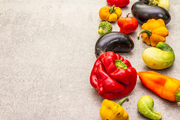 Trendy ugly organic vegetables. Assortment of fresh pepper, eggplant, cucumber, tomato, pumpkin