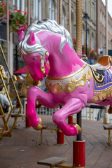 Fototapeta na wymiar fairground horse pinky colour 