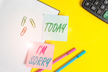 Text sign showing I M Sorry. Business photo showcasing Toask for forgiveness to someone you unintensionaly hurt Empty blue paper with copy space paper clips and pencils on the yellow table