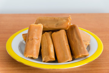 Polish traditional milk toffee candies krowki meaning little cows.