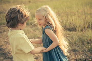 The concept of child friendship and kindness. Valentines day. Child care. Valentine. Sweet childhood. Sweet angel children. Child with angelic character. First love.