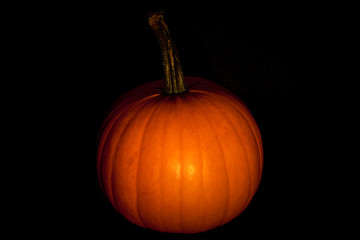 Pumpkin in darkness. Halloween mood.