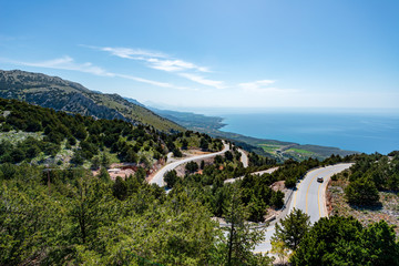 Fototapeta na wymiar road in sunny mountains in greece